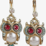 Owl symbolism in jewelry and fashion.