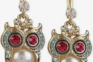 Owl symbolism in jewelry and fashion.
