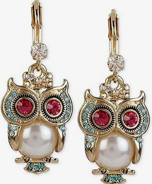 Owl symbolism in jewelry and fashion.