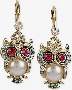 Owl symbolism in jewelry and fashion.
